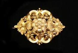 gold brooch of flowers